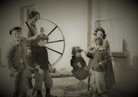 Family Group and Spinning Wheel