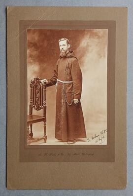 Studio photograph of Fr. Urban Riordan
