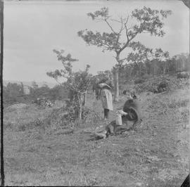 Two Women on a Forested Hillside