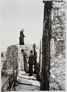 Capuchin friar on castle ramparts